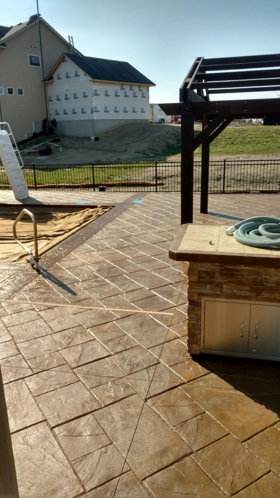 decorative concrete pool deck - Ankeny, IA - Stamped Concrete