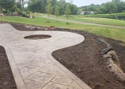 Decorative concrete patio walkway and fire pit - West Des Moines, IA