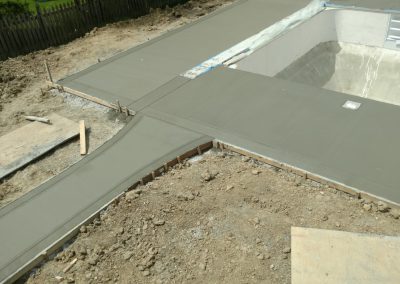 Concrete pool deck with color ribbon border - West Des Moines, IA