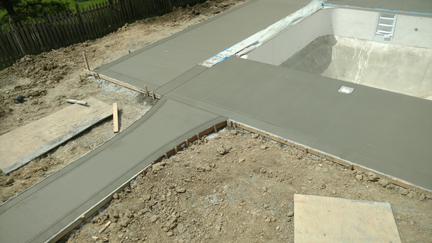 Concrete pool deck with color ribbon border - West Des Moines, IA - Des Moines metro area