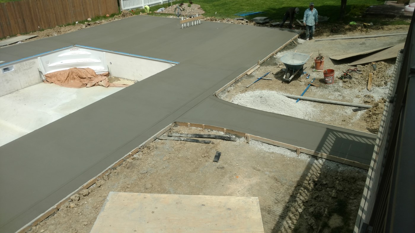 Concrete pool deck with color ribbon border - West Des Moines, IA - TRW Concrete Contractors