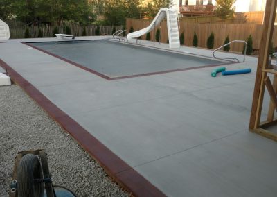 Concrete pool deck with color ribbon border - West Des Moines, IA